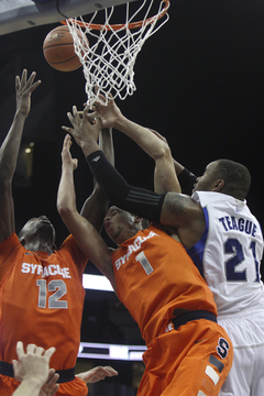 Michael Carter-Williams and Baye Moussa Keita fight Seton Hall's Gene Teague for the ball in the Orange's 76-65 victory at Seton Hall Saturday night.