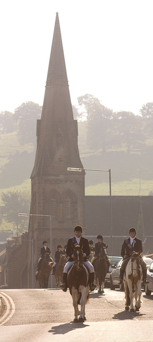 Riders arrive in Lockerbie in the early morning of Gala Day, an annual celebration and highlight of the year for the town. Lockerbie is located in the southwest region of Scotland.