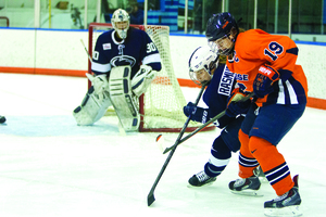 Senior Margot Scharfe jostles for position. She and the rest of SU's seniors are looking to close out their careers with a College Hockey America championship.