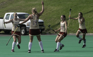 No. 11 Boston College celebrates its 3-2 overtime victory over No. 4 Syracuse on Saturday.