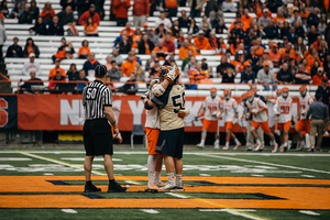 The Varello brothers embraced as the game concluded after Joe scored the game-winning goal for Navy.