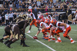 SU's offensive line readies for a play against Western Michigan on Aug. 31.