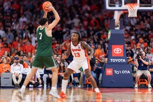 Syracuse forward Jyare Davis (pictured, No. 13) recorded a team-high 22 points off the bench to lead the Orange to a victory over Le Moyne.