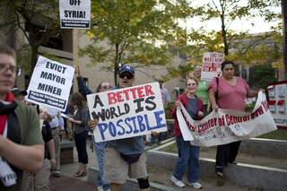 Supporters held up signs at the beginning of their walk.