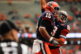 Syracuse receivers Alec Lemon and Jarrod West celebrate following a Lemon touchdown grab.