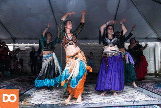 Bharatanatyam  is a classical dance form from South India. Maya Jibe performed the dance in a tent at the street fair despite the rain.