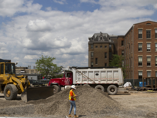 A construction worker walks along the new sewer line on Waverly Avenue, near the soon-to-be site of the National Veterans Resource Complex. Photo taken by July 11, 2017