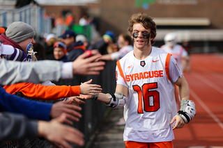 Brendan Curry runs past fans postgame. 